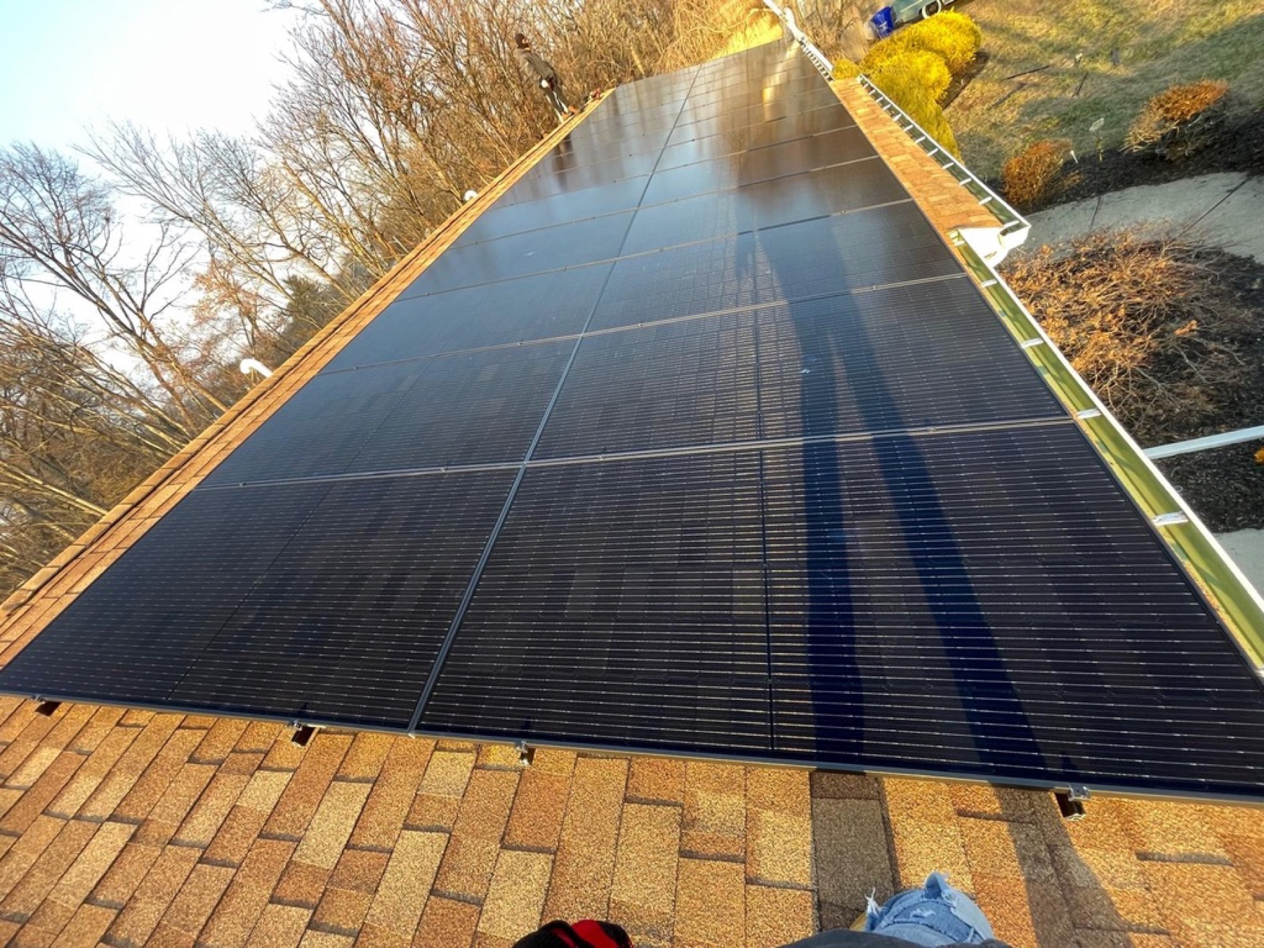 Completed residential GAF roof with monocrystalline panels