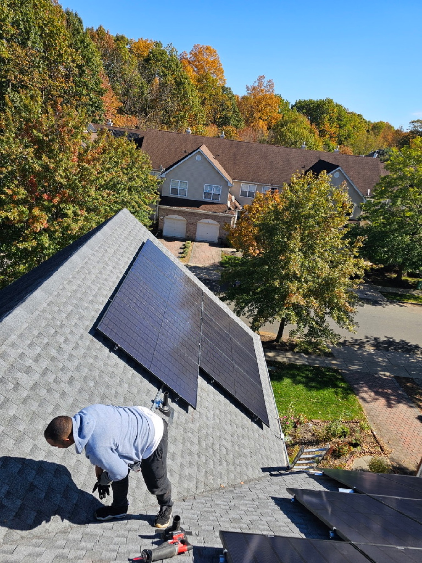 Installer shadow on a completed residential solar array