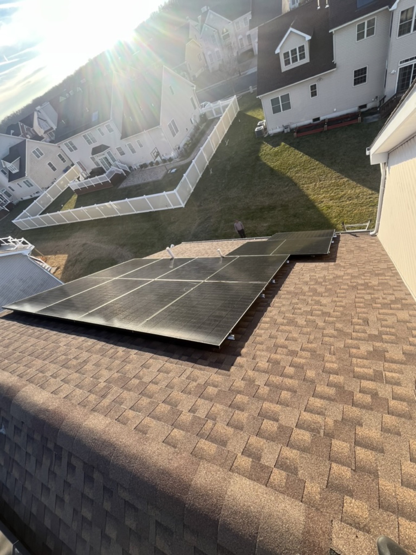 Golden-hour drone shot of a residential Reliant Solar installation