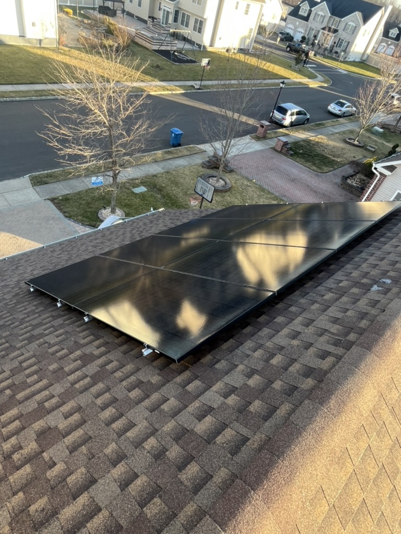 Drone shot of a completed residential install on a shingle roof